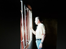 Steve looking out the window of the new building.