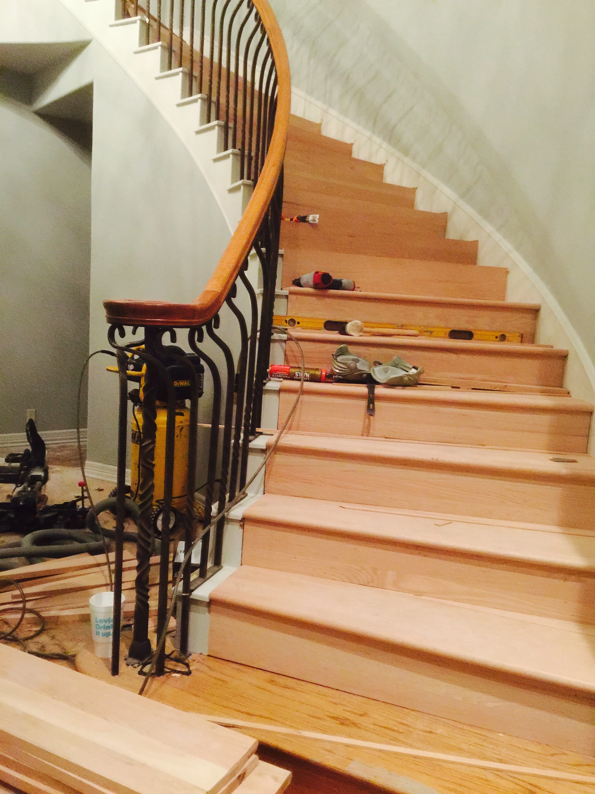 Removed carpet and installed curved solid oak stair treds.