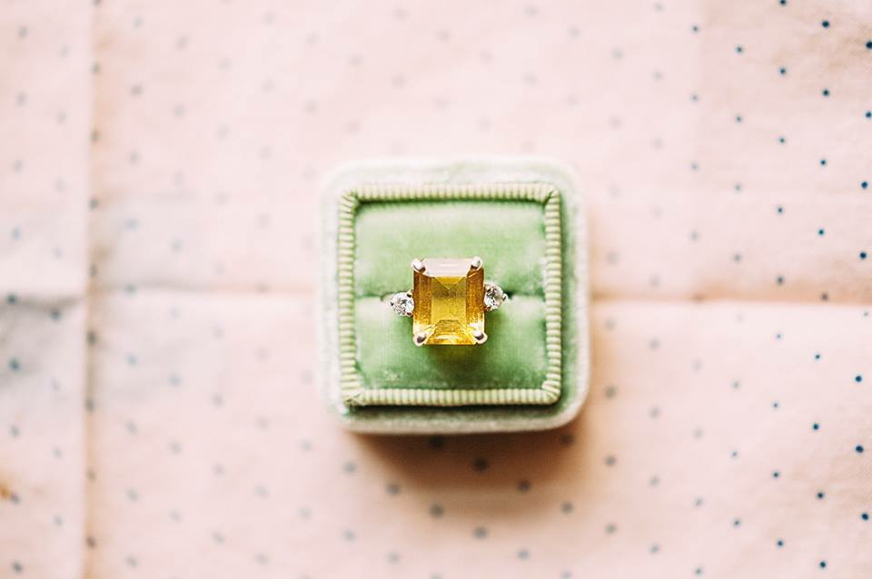 This shot was taken with a Sigma 105mm with my Nikon D3. I took this on a cake plate in front of the window with my step stool so I could shoot from above. The f-stop was a 2.8 :) I actually focused on the center of the ring and it turned out well! (normally I'd focus on the closest prong to me....) This is edited in LR with my VSCO Film Preset! 