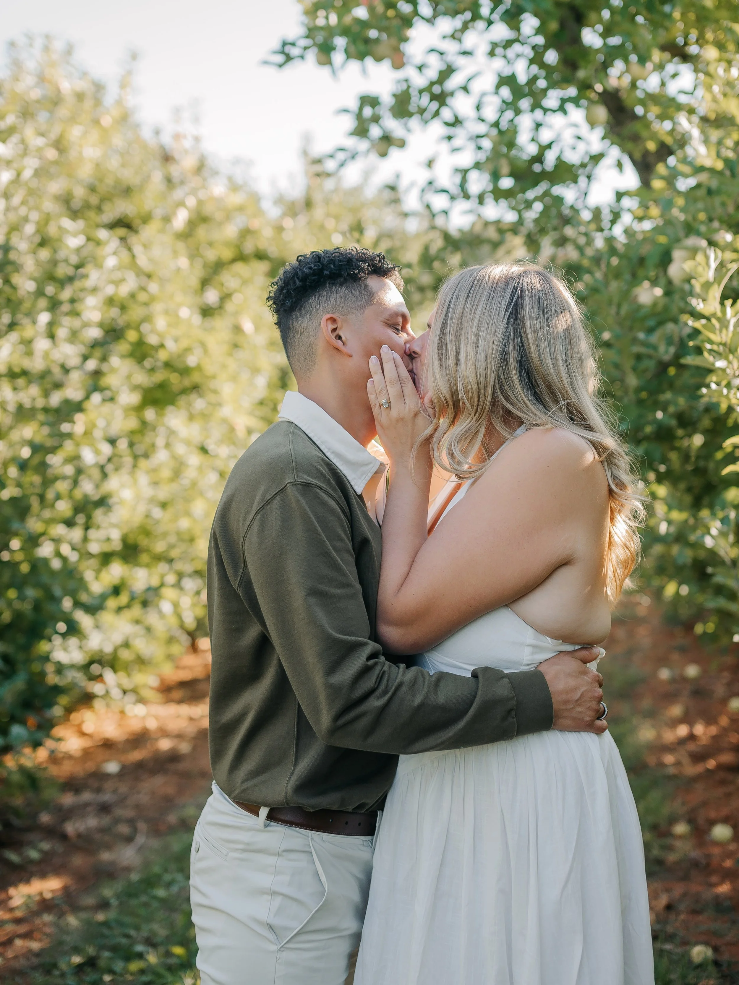 For the couple who wants their photos to feel like them. 🤍

Not stiff.

Not overly posed.

Not two hours of wondering what you&rsquo;re supposed to do with your hands.

Just the two of you&mdash;
walking through the apple orchard,
laughing until you