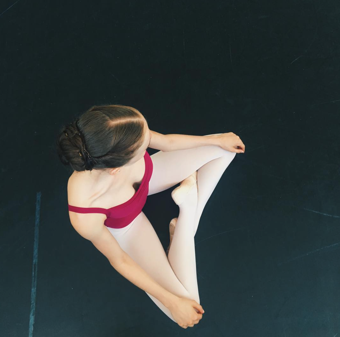 grace pictured wearing mdm antares leotard, maroon.
