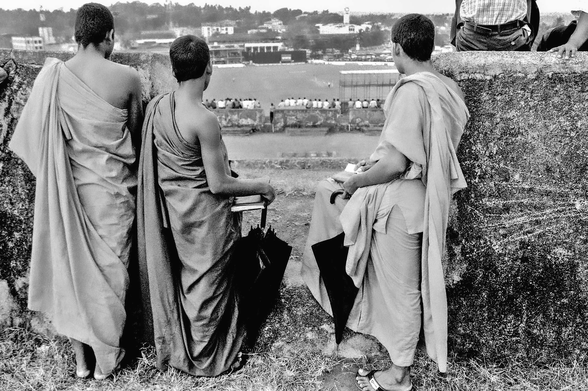 Buddhist monks watching a one-day international from Galle Fort, August 1999