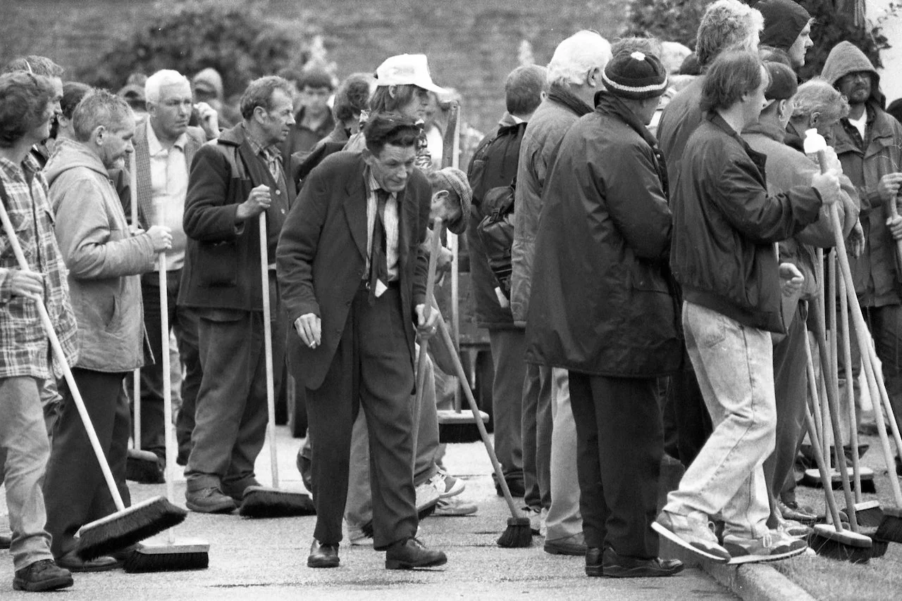 Unemployed men wait inside Lord’s to start cleaning the ground after stumps, Second Ashes Test, June 1997 