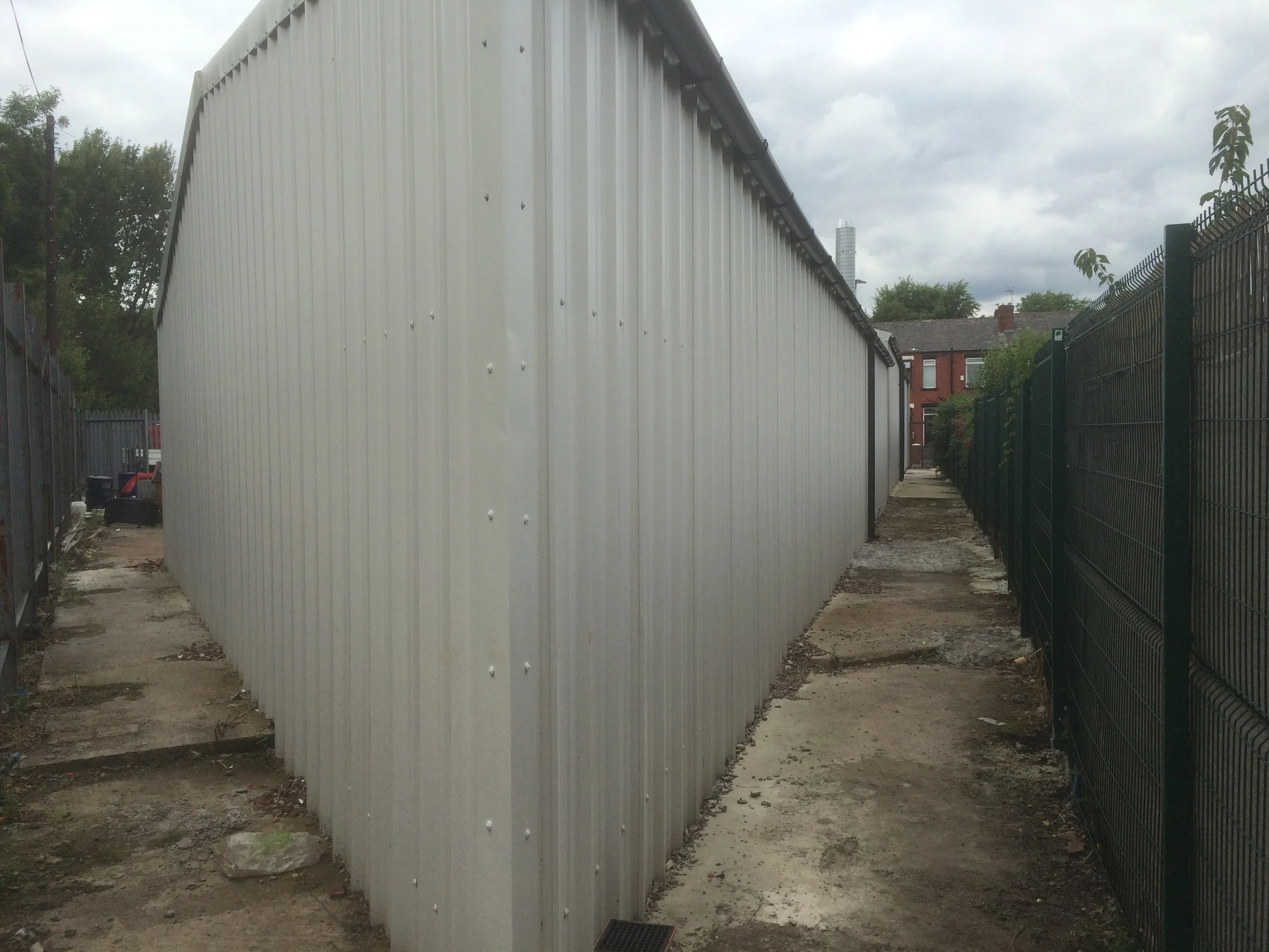 Unequal length industrial building complete.