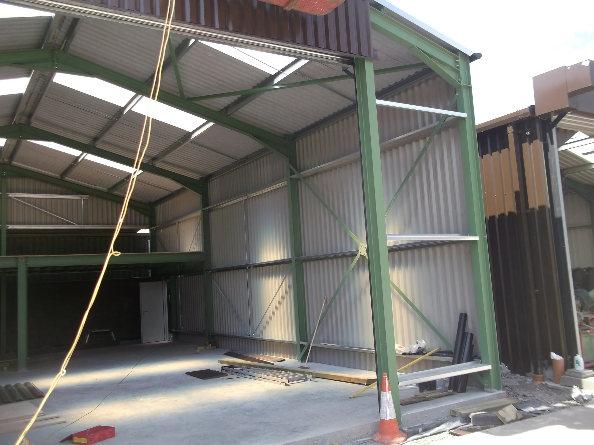 Industrial building with mezzanine being erected.