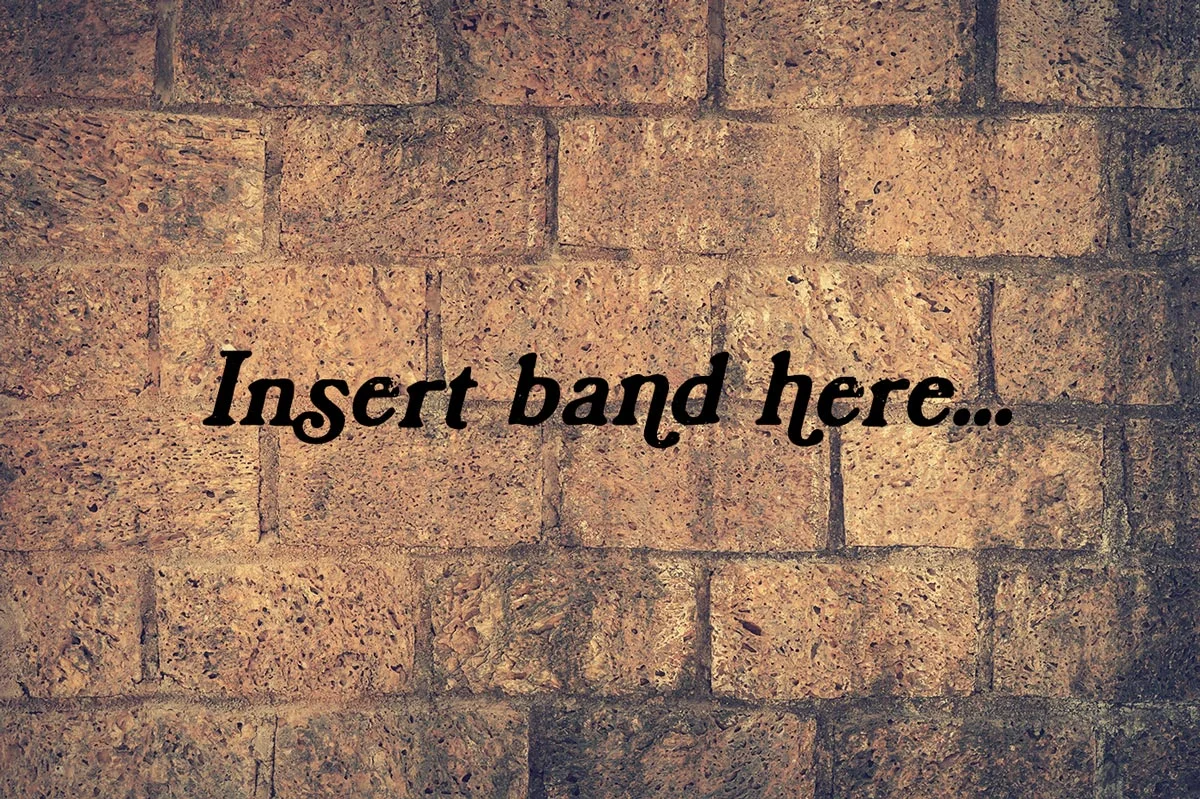 Image of a wall with some text that reads 'insert band here.' Accompanies an article about music photography for bands.