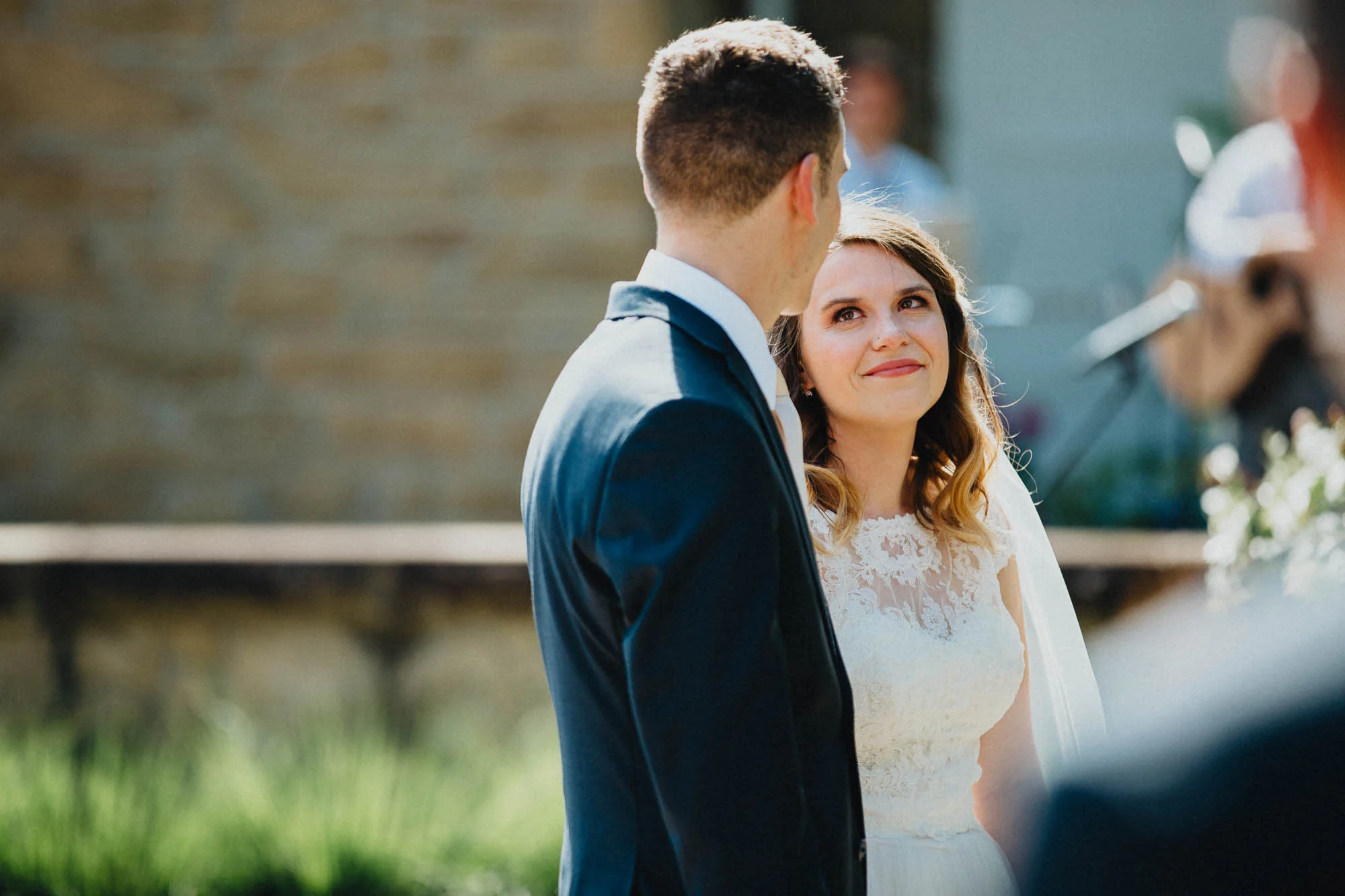 Bride Looks Lovingly At Her Groom During Their Ceremony