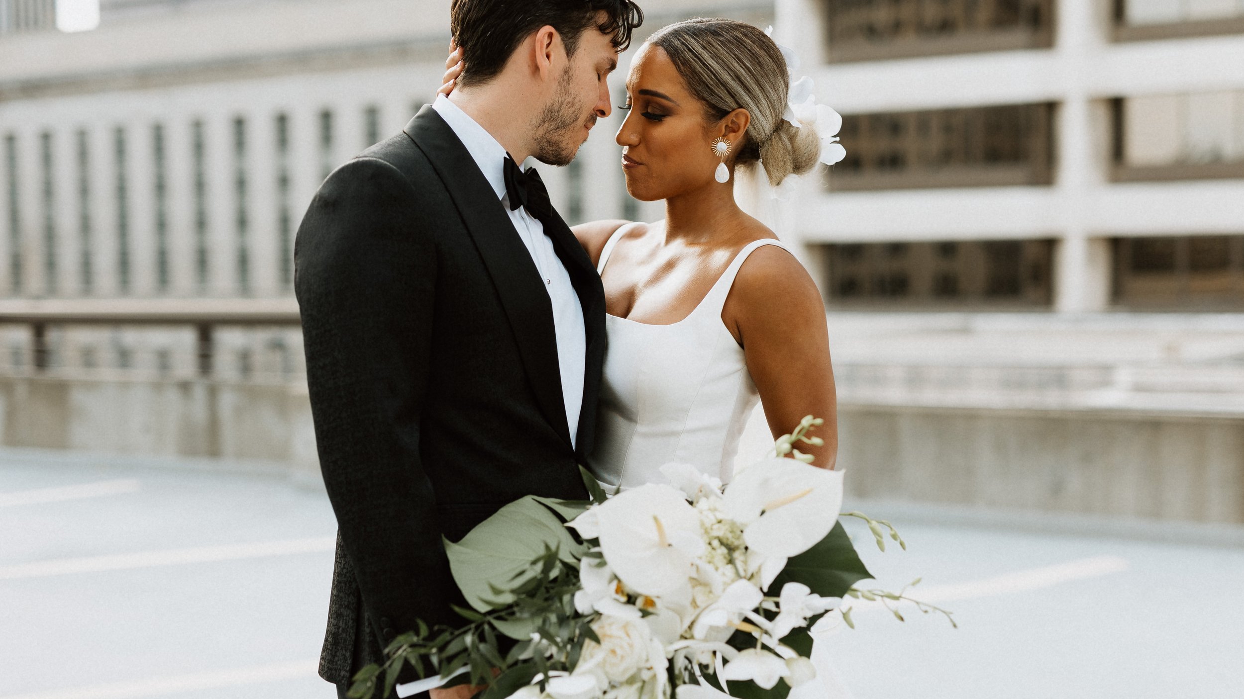 Bride and Groom snuggles Cincinnati downtown