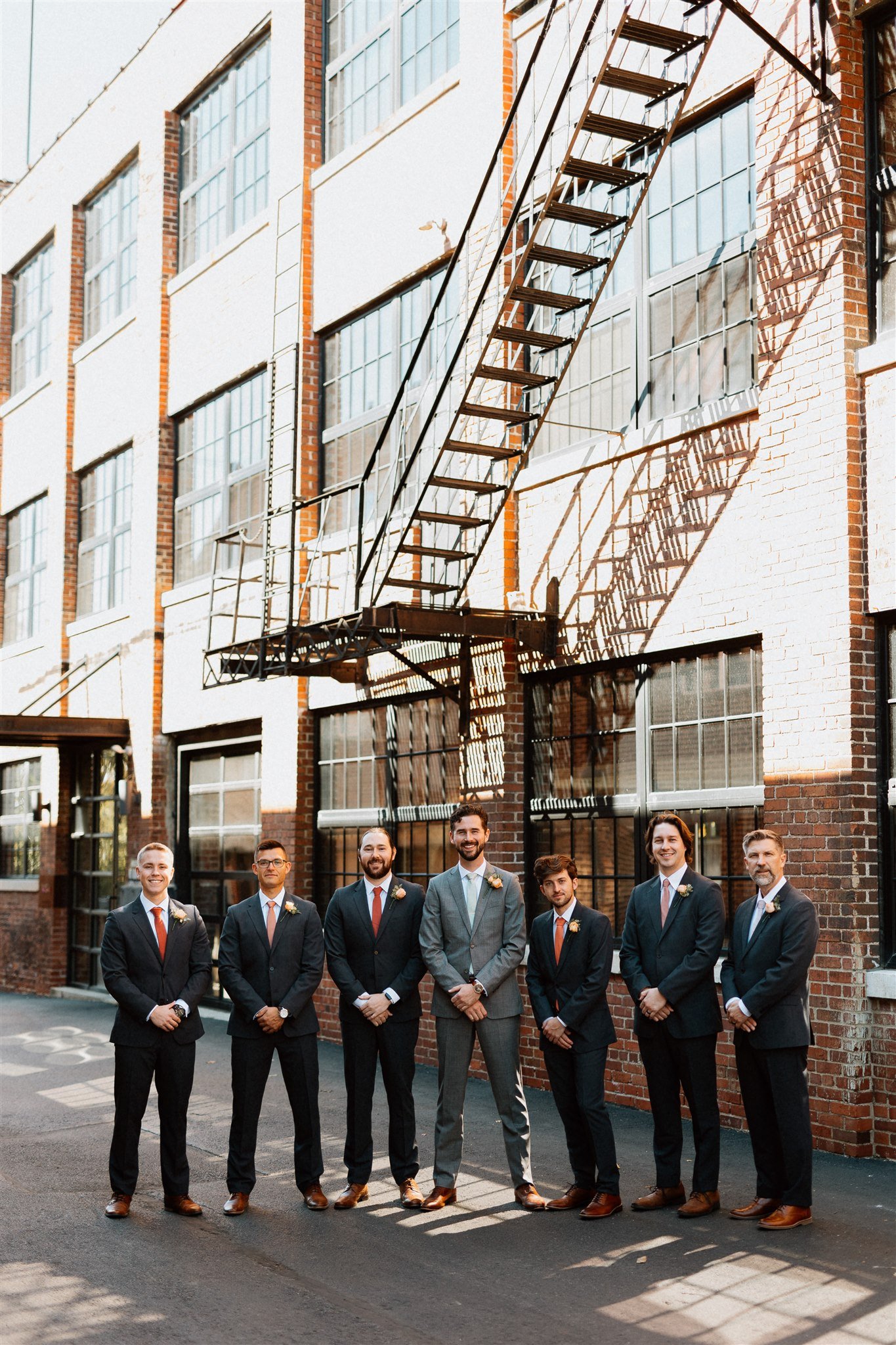 Groomsmen portrait in alley