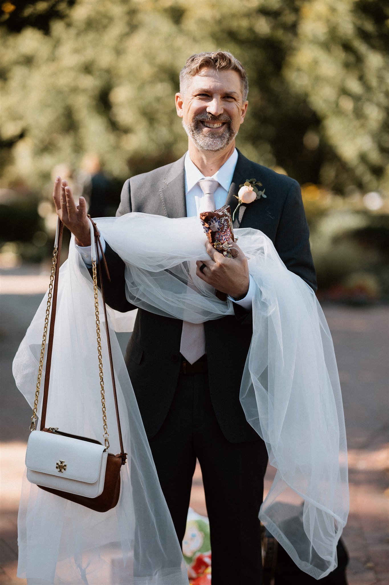 father of the groom helping 