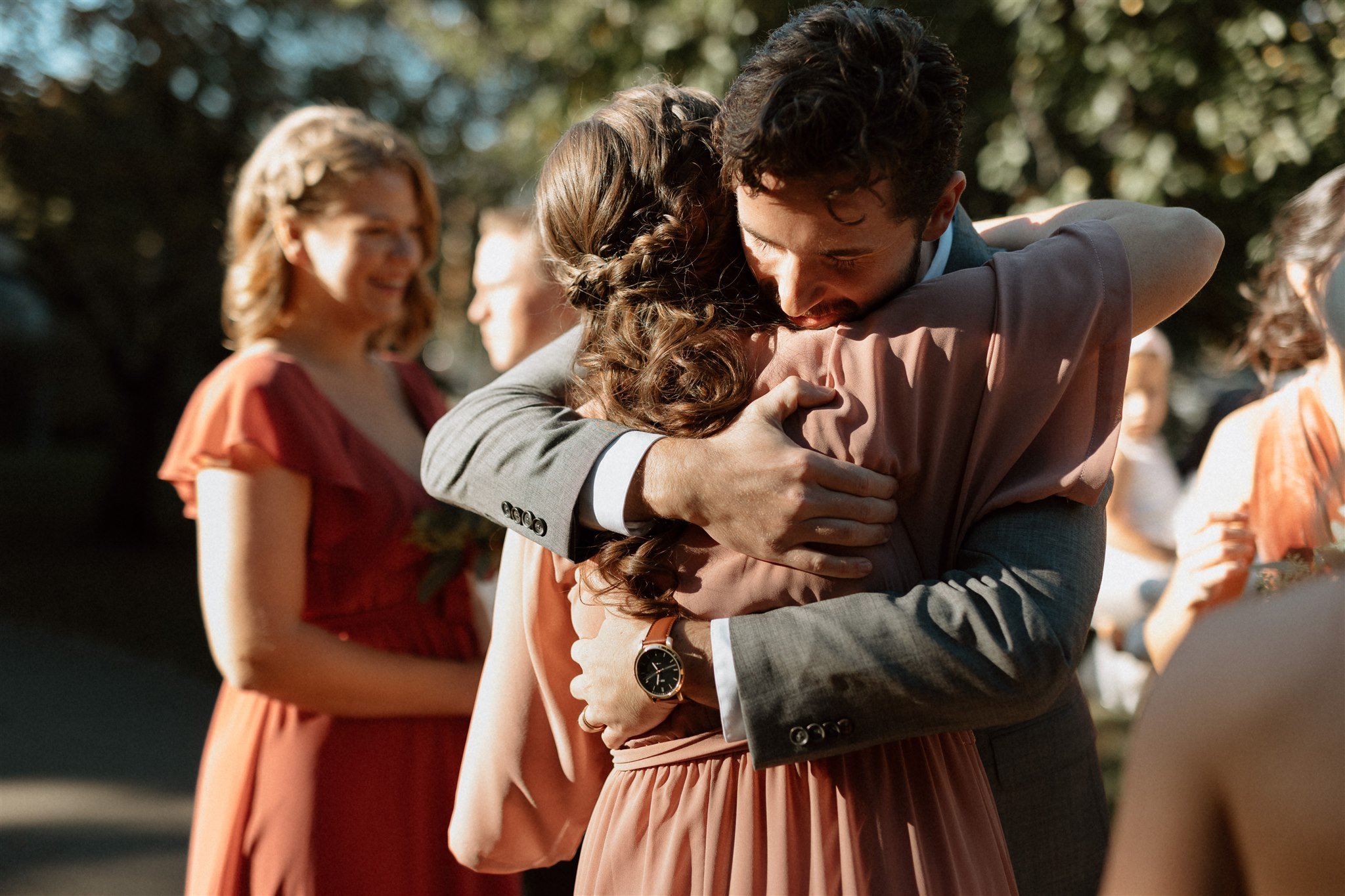 groom hugging sister