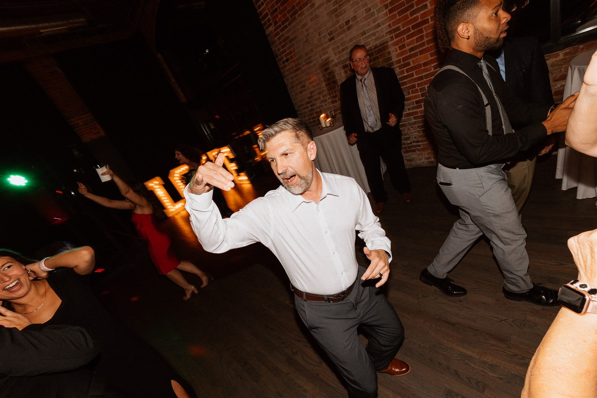 father of groom dancing