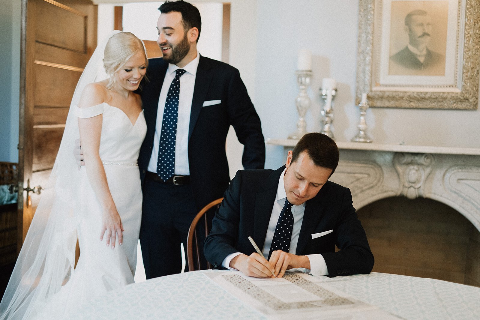 officiant signing ketubah