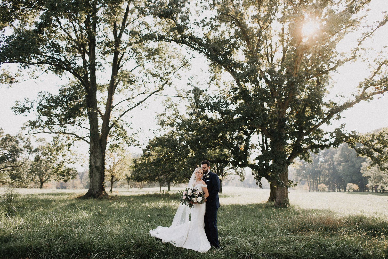 Bride and Groom in a field Camargo Club Wedding