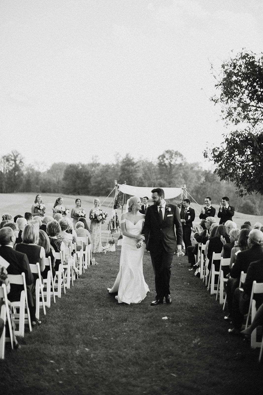 Bride and Groom walking down aisle outdoor wedding