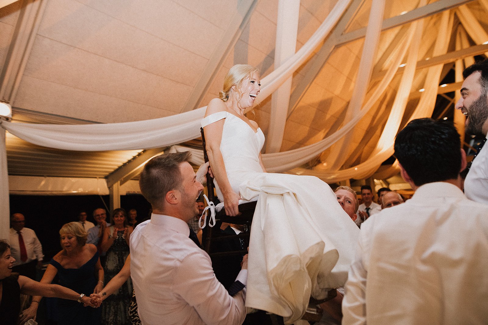 bride on chair during horah