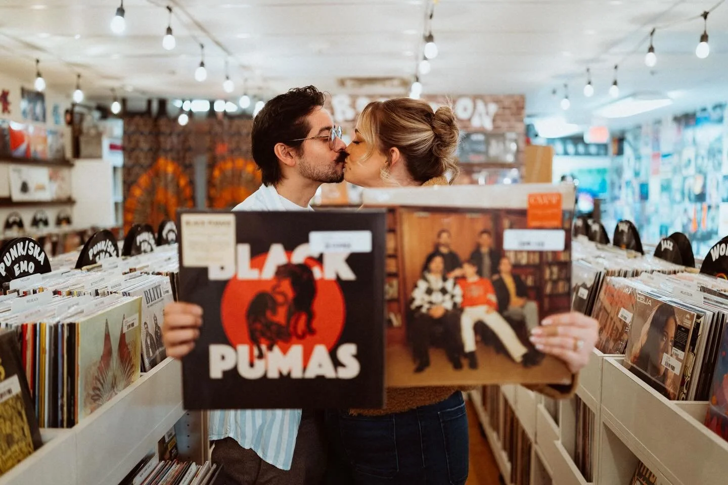 Here&rsquo;s your sign to do your engagement photos in a record store.

#wearethebrauns #recordstorecincinati #engagedinthecity #rainydayphotography #milfordohio