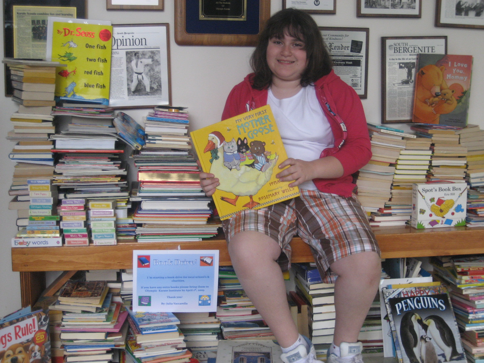 Julia Raises 1,000 Books for TheDOJO Book Drive and Starts a Library