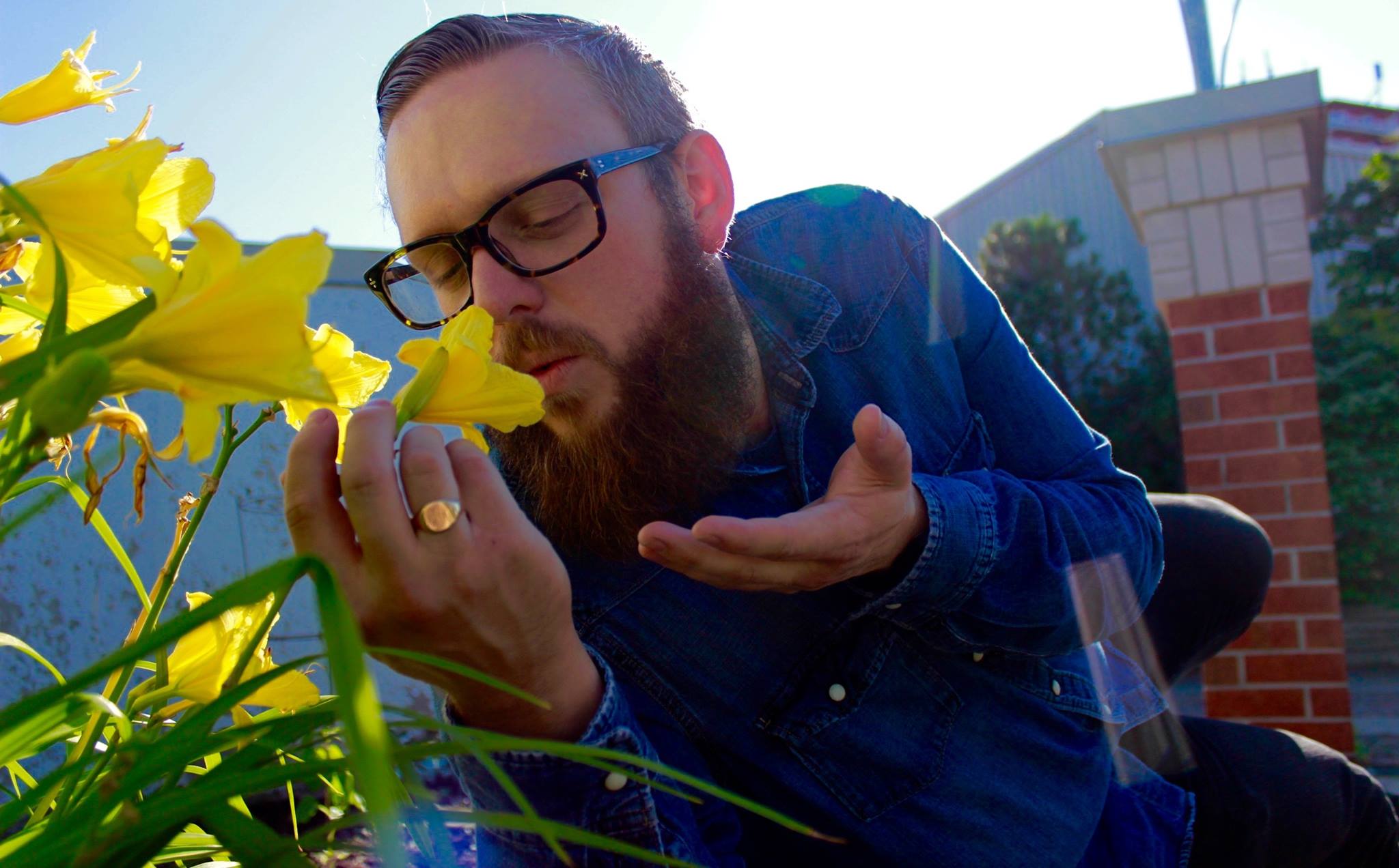Pictured: Greg whispering sweet nothings into that flower. What we wouldn't give to be that flower, amirite?