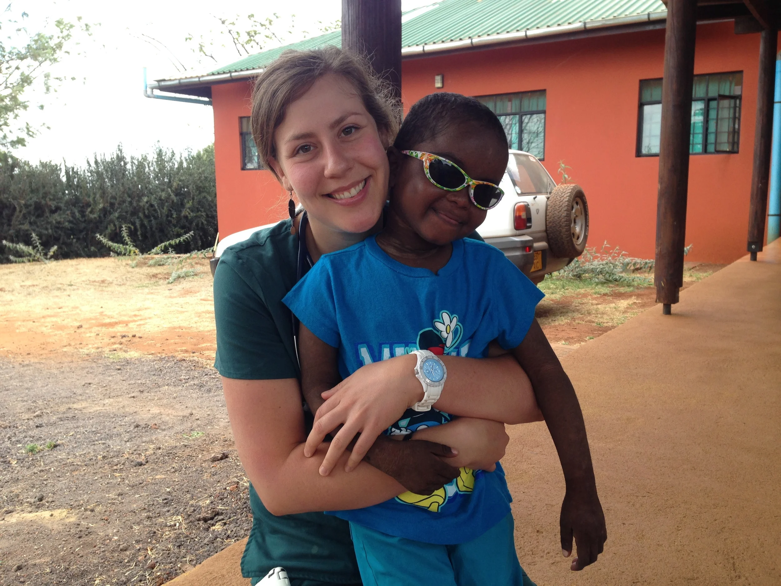 Chana with little patient on discharge day, after a very long healing process