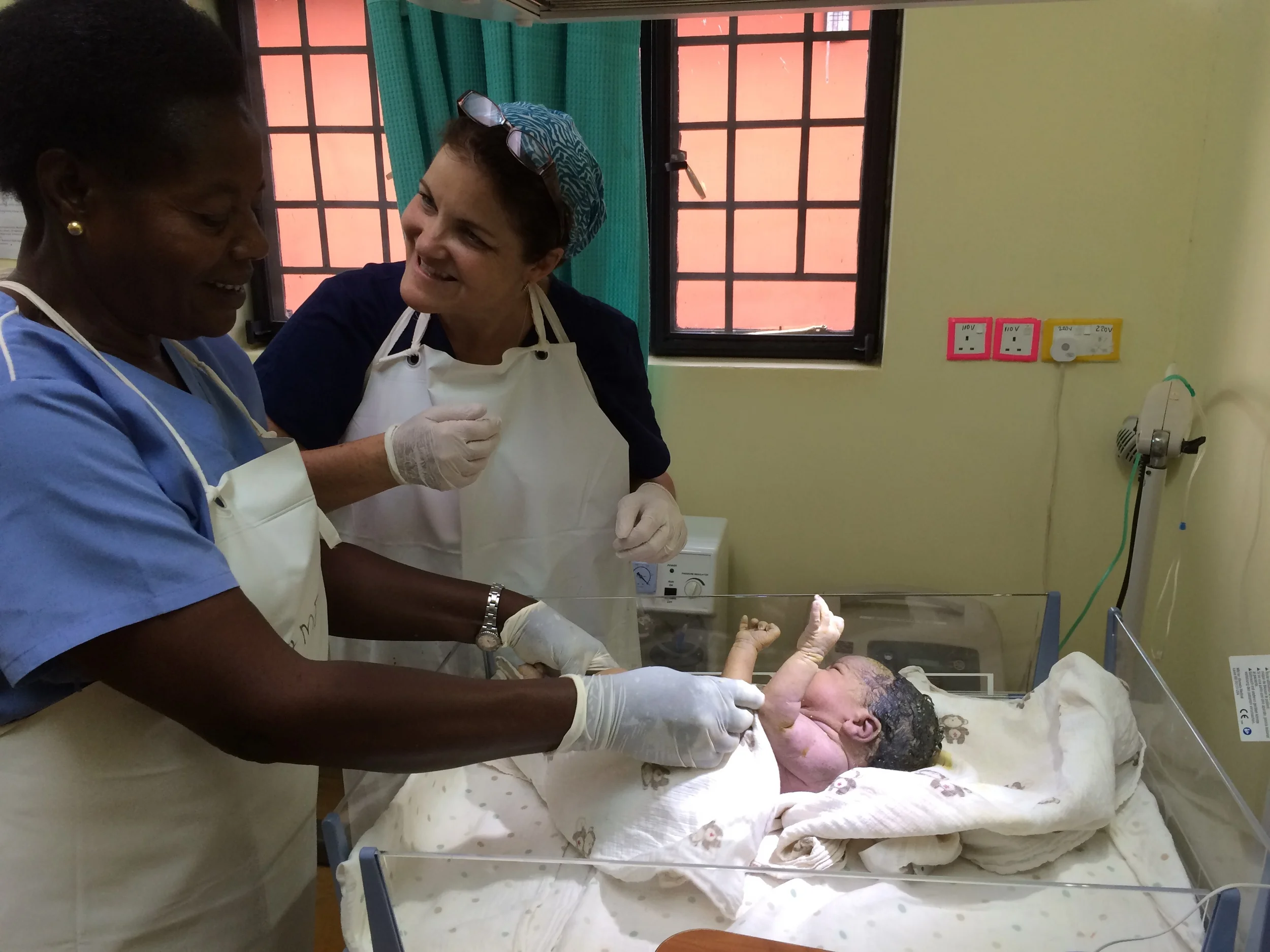 Nurse Evelyn, Volunteer Nurse Barb and newborn
