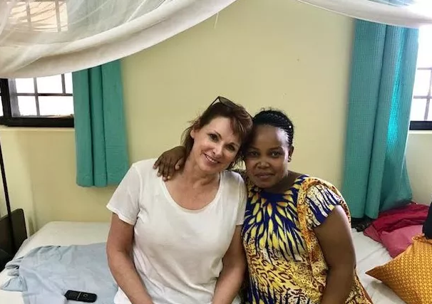 DfG volunteer, Alexa, with a new mama in our current labor ward.