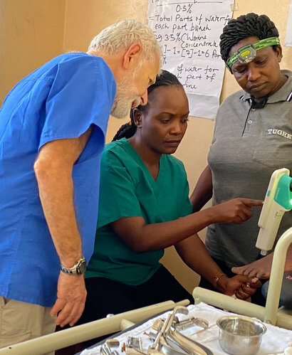  Dr. Paul, Dr. Anne, and Head Nurse Siana, confer about the results of a colposcopy exam. 
