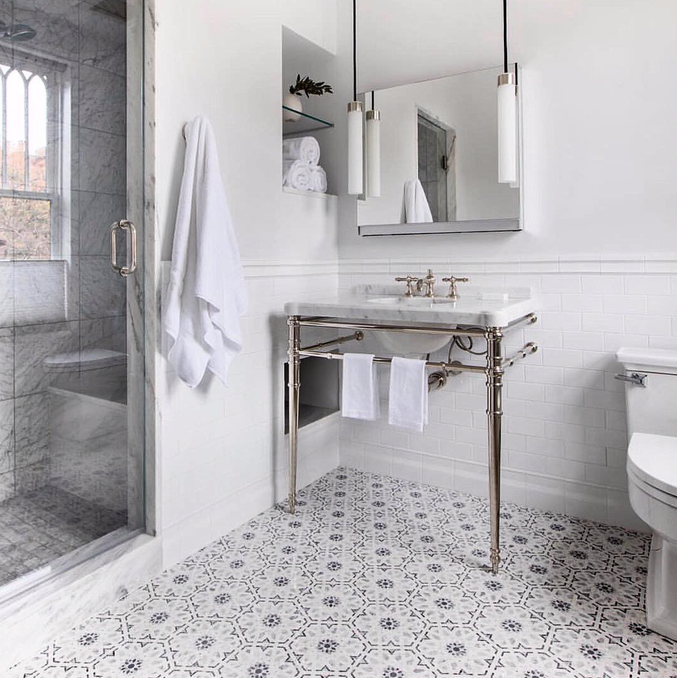 Traditional meets modern in this classic bath by @reid_havenbuilders . The Uplift lighting and cabinetry is paired with the Inigo collection by @kallistaplumbing .