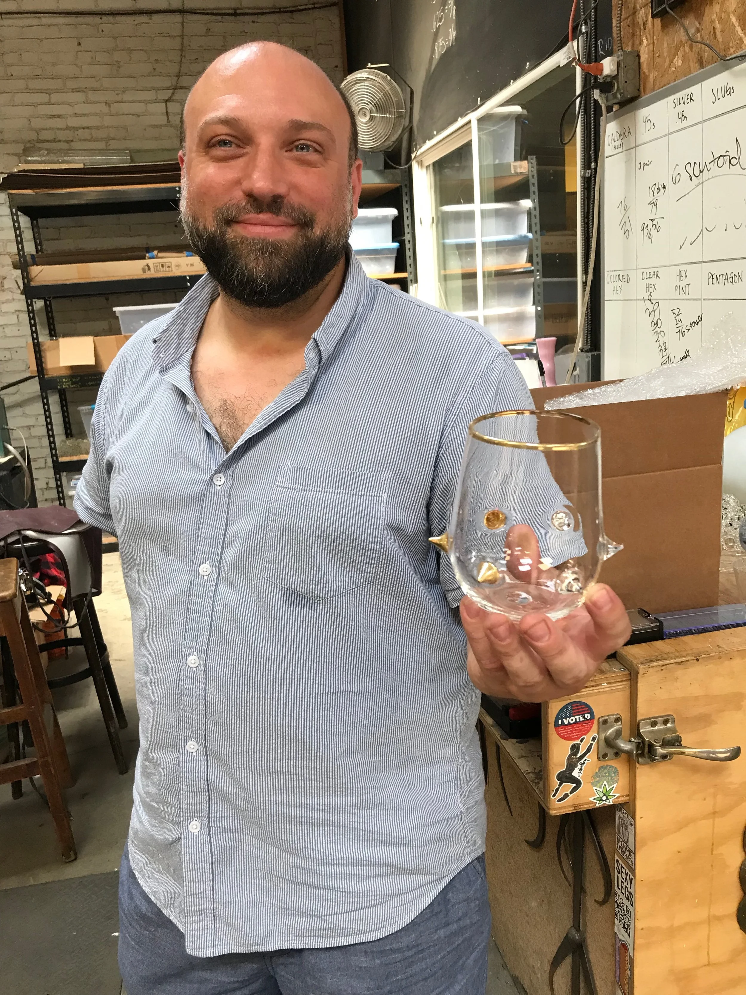 Uri Davillier with a Golden Spike cup from a set of six. For the large sets, Uri creates a different number of 23-karat gold spikes so you don't lose track of which glass is yours at a party.