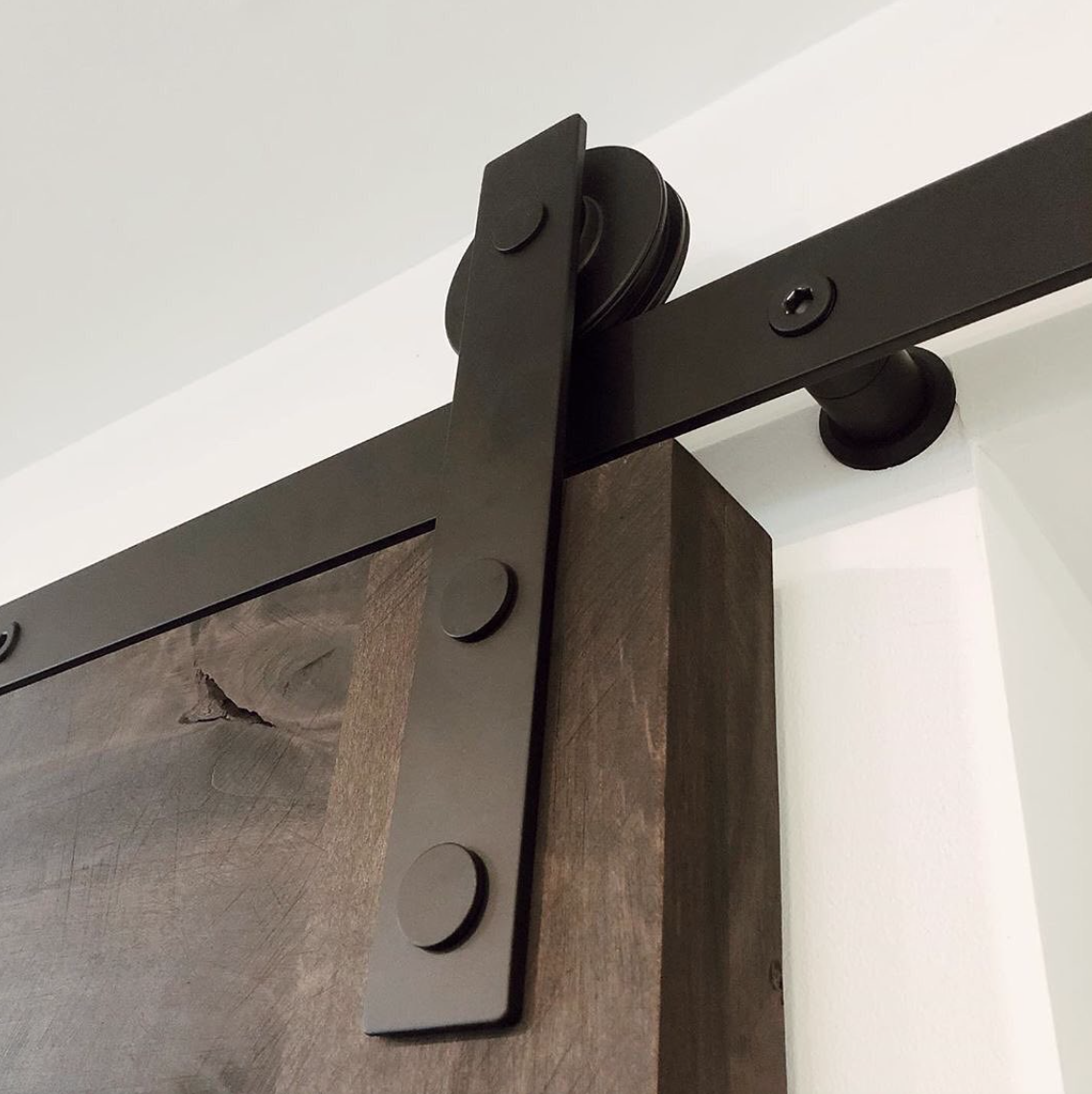 They’re also answering the farm house trend with sliding, barn door hardware.