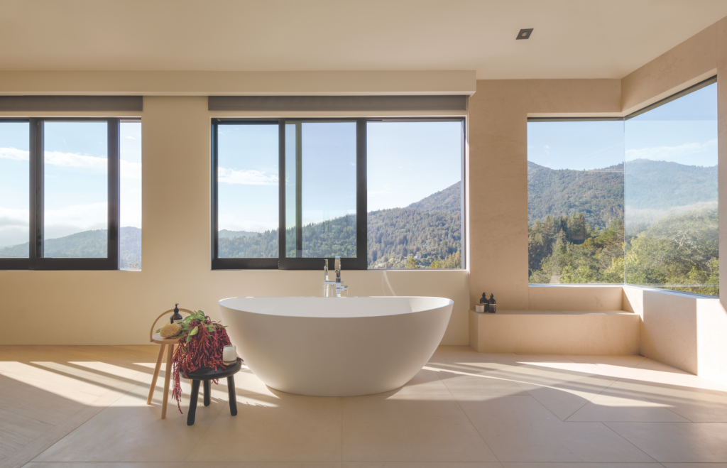 A soaking tub with Graff faucets provides a covetable vantage point. Photograph by Eric Rorer