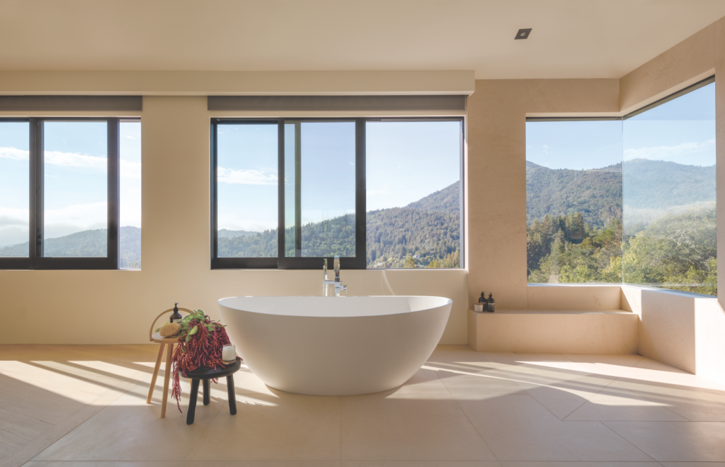  A soaking tub with Graff faucets provides a covetable vantage point. Photograph by  Eric Rorer  