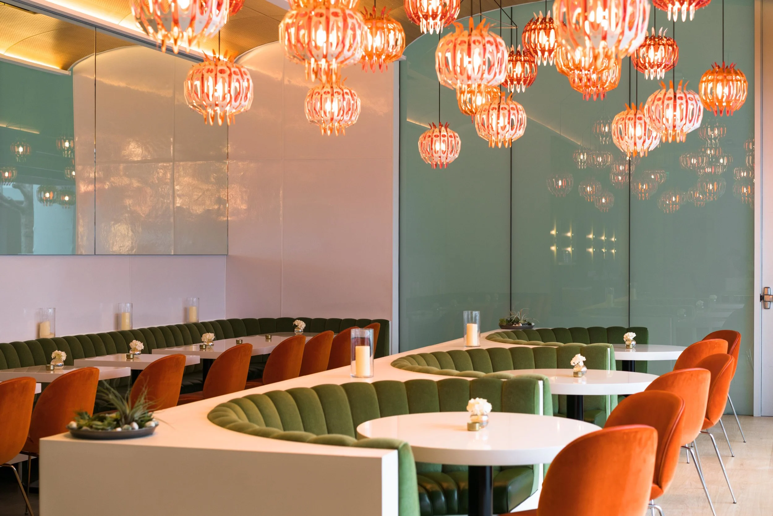 “The Gubi chairs are a classic, mid-century element and match with the banquettes as they are also dressed in both mohair and leather in tone-on-tone earthy orange shades to add depth,” says Tom.