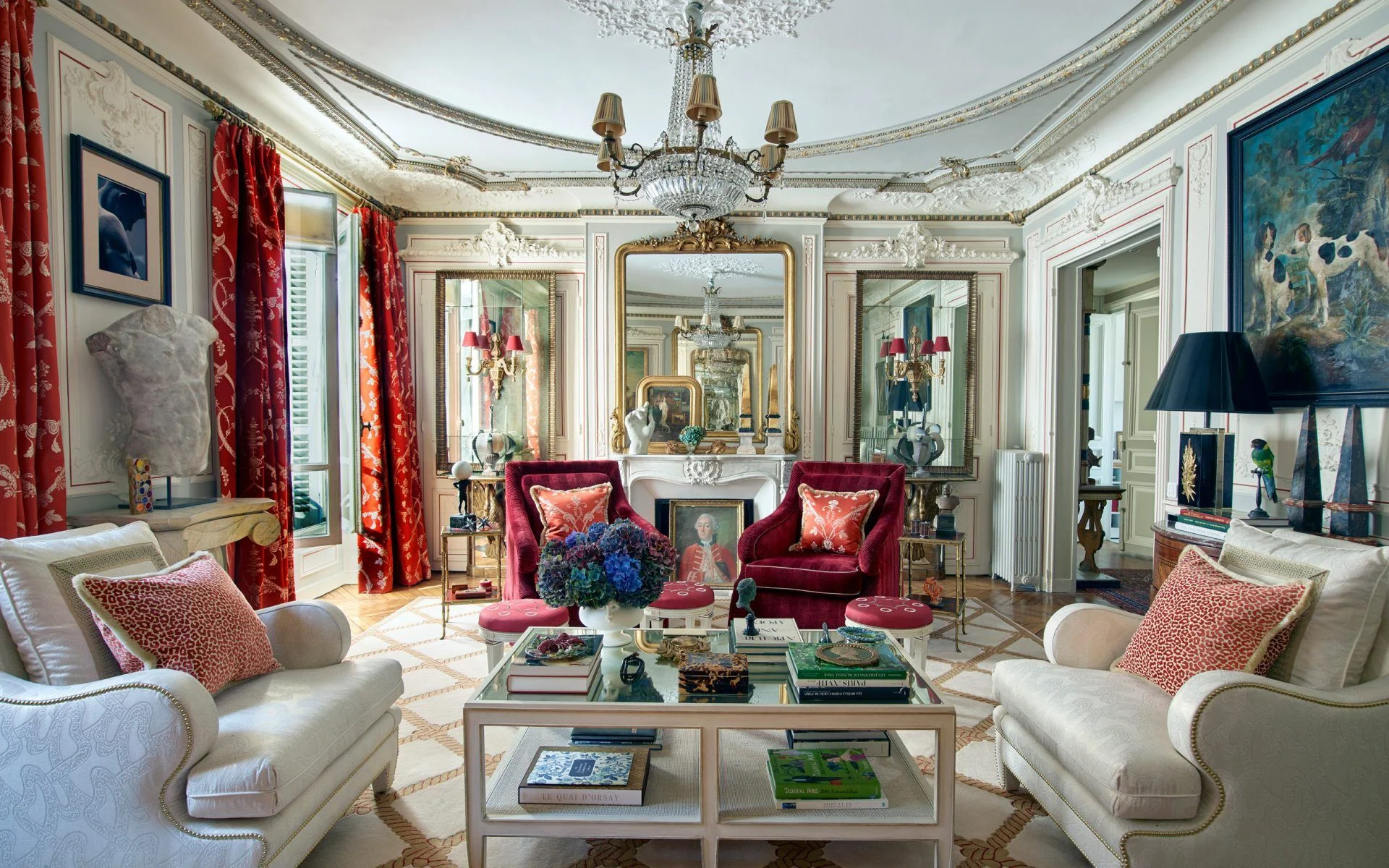 A room in Timothy Corrigan's new book by Rizzoli features a play of reflections with multiple mirrors. The seating and cocktail tables are from Corrigan’s furniture collection for Schumacher, and the rug is one he designed for Patterson Flynn Martin. Photo: Richard Powers