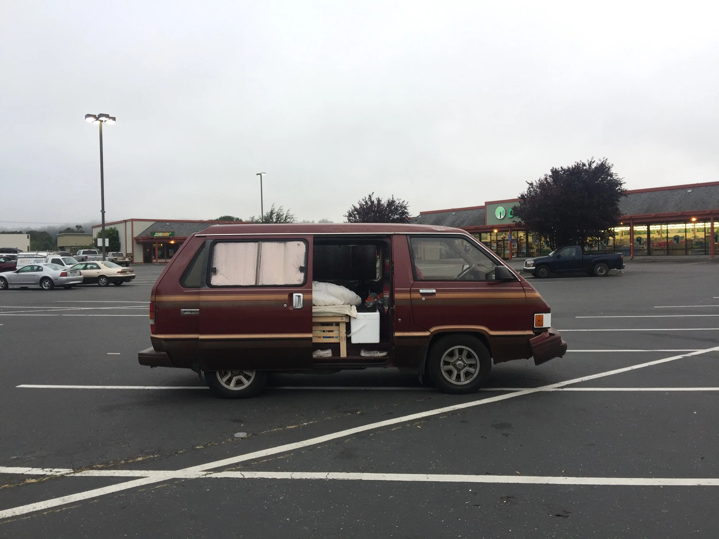  Broken down in the parking lot of Arcata, California. The van’s alternator died and we ran the battery down to nothing, sputtering to a halt. We got a tow to the nearest Napa Auto and waited for the new one until the next morning. We we’re back on t