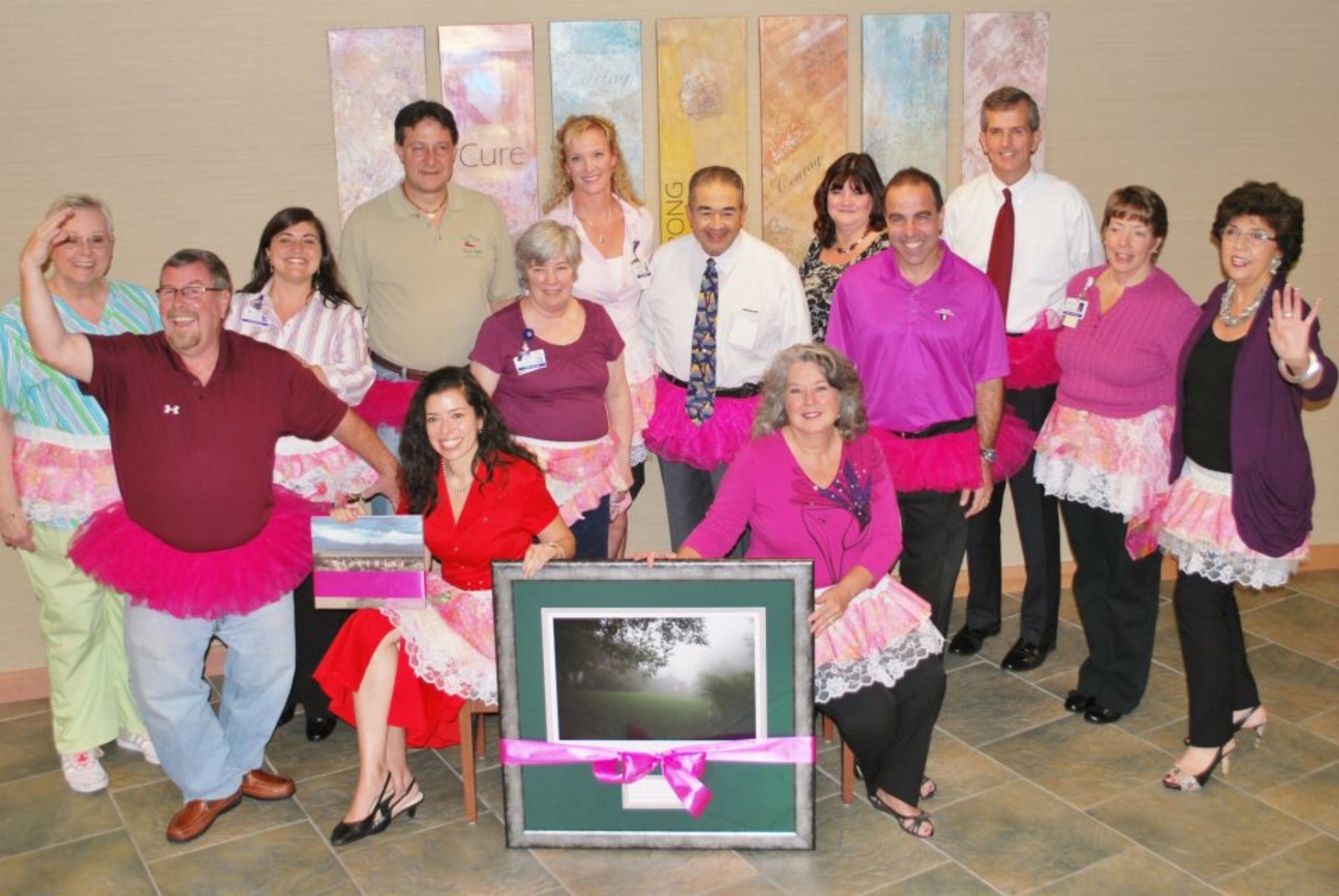 Everyone donned their pink tutus to present a special photograph and book from Blossoms of Hope to the Claudia Mayer Cancer Resource Center in 2012.