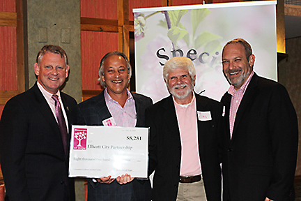 Allan Kittleman (Howard County Executive), Joe Barbera (BOH Board Chair), Ed Lilley (ECP) and Jon Weinstein (Howard County Council) posing with check for the Ellicott City Partnership.