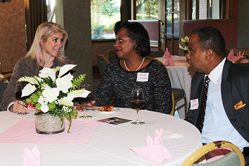 Christa Giangrandi chatting with Thelma and Luther Johnson