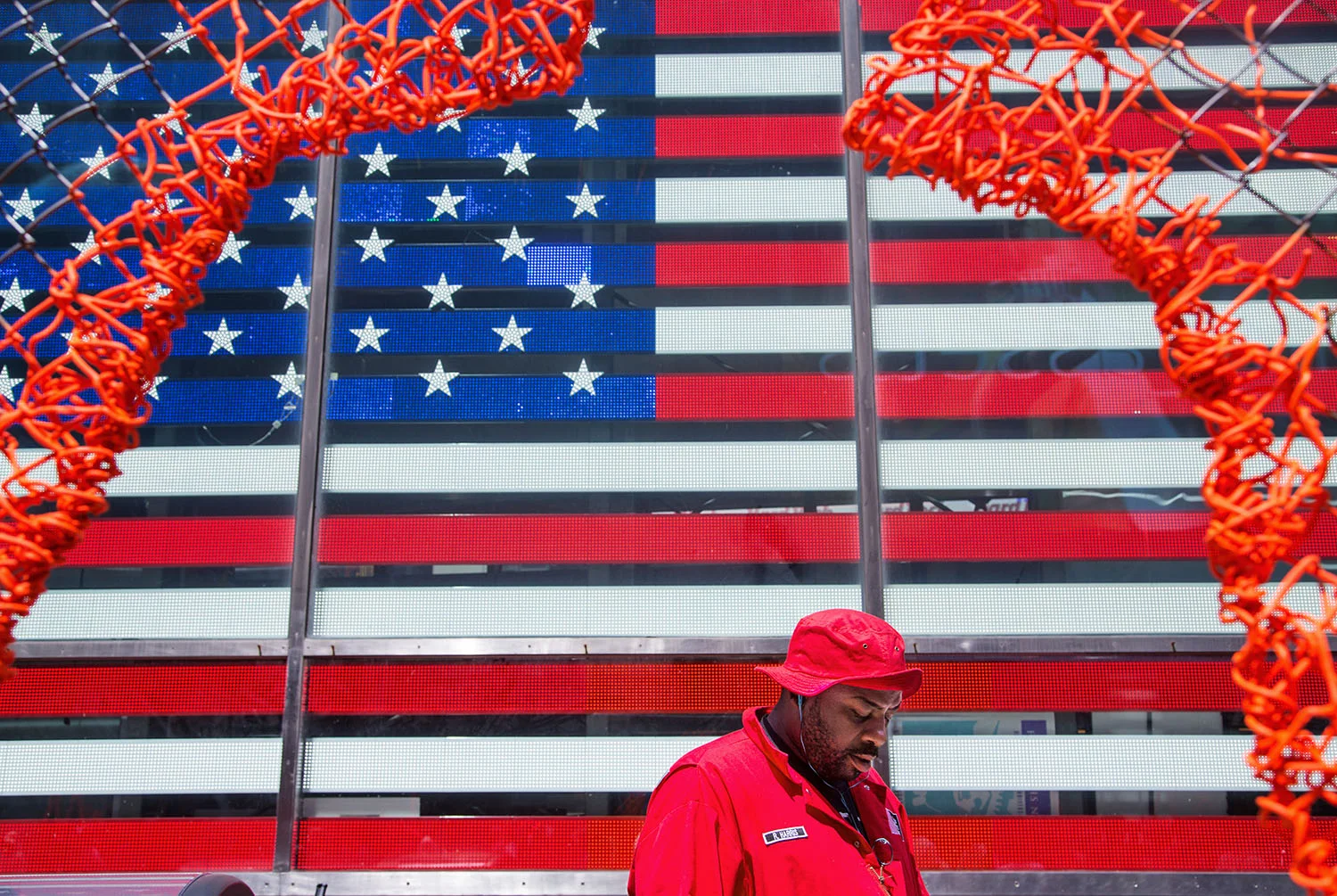 A custodial worker passes through Times Square in New York, N.Y., on July 17, 2014. 
