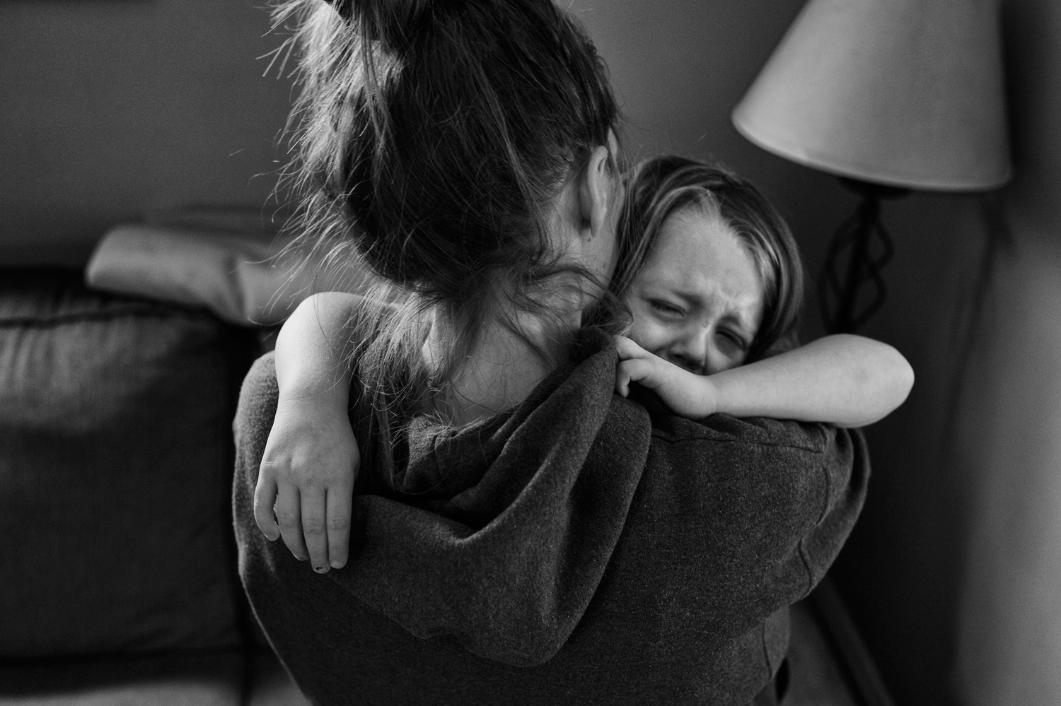 Adwen Lorkovich (cq), 5, is consoled by her mother after her five siblings left for school in Mayfield Heights, Ohio, on November 24, 2013. Out of the family's six children, Adwen is the only one who shares both parents biologically.