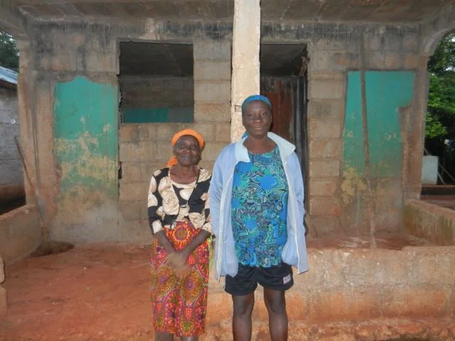 women in front of home.jpg