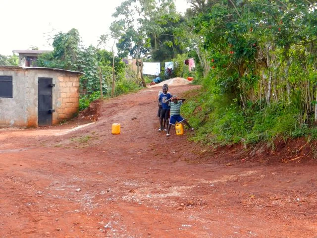 kids with water cans.jpg