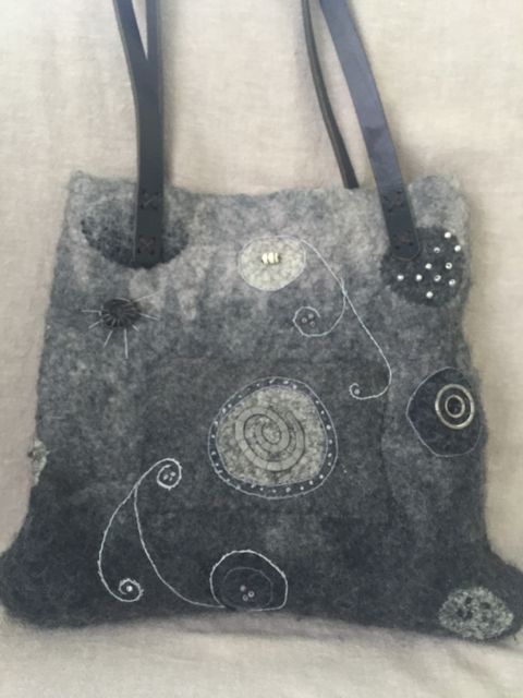 Wet felted tote embellished with beads and embroidery.