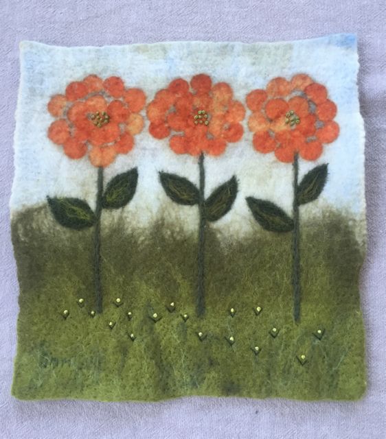 Wet felted, eco printed wall hanging, embellished with embroidery.