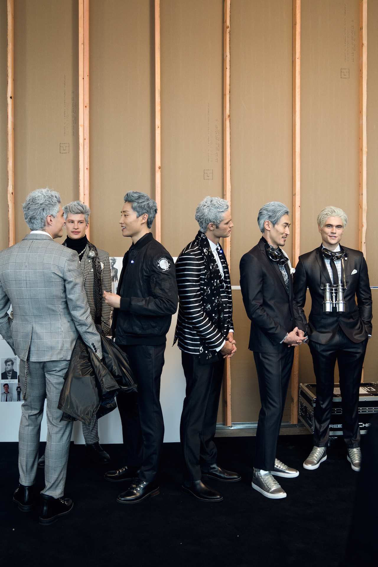 Silver-haired models hanging backstage before walking out onto Nick Graham's space-themed runway. Shot with my Sony A7RII w/ Sony 24-70 2.8 G Master | ISO 500 | 1/125s | f/2.8
