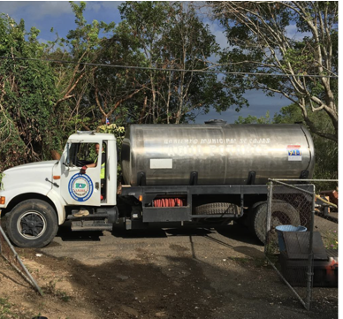 Municipal water trucks delivering water to mountain towns in Lajas 