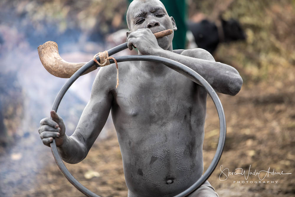 A horn is often played as part of the blood letting and drinking ceremony.