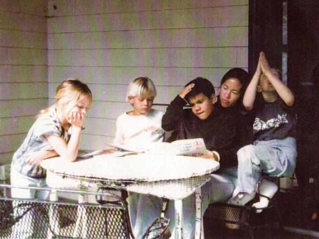  A moment from the El Niño School, including Sean's son Johnny Herzig (center) on Ruth Alker's lap