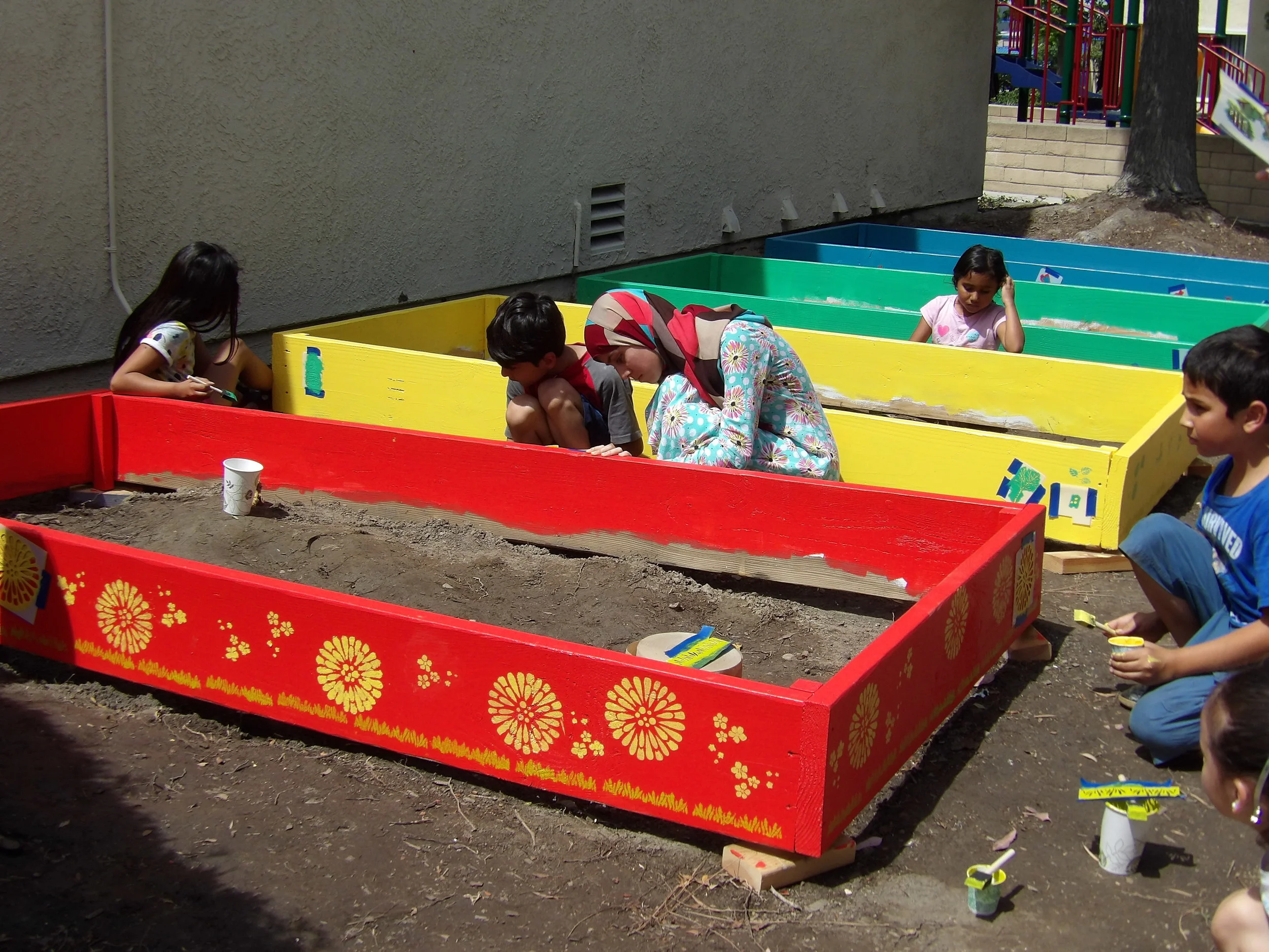  Decorating the beds is a group effort 