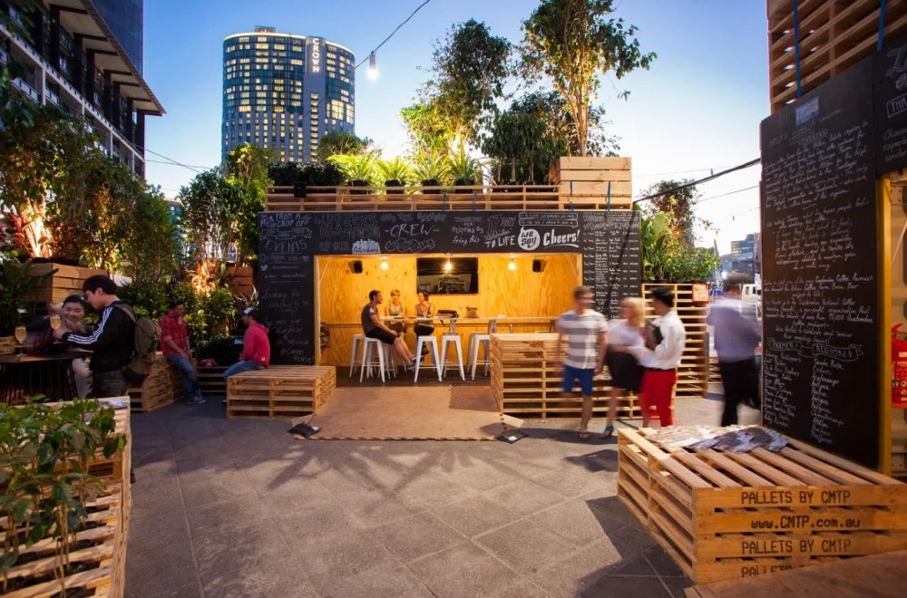 Urban Coffee Farm by Hassell for the 2013 Melbourne Food & Wine Festival . A project to show the community about the journey of coffee with an innovative reuse of shipping containers and pallets. 
